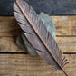 Copper Feather on Rock